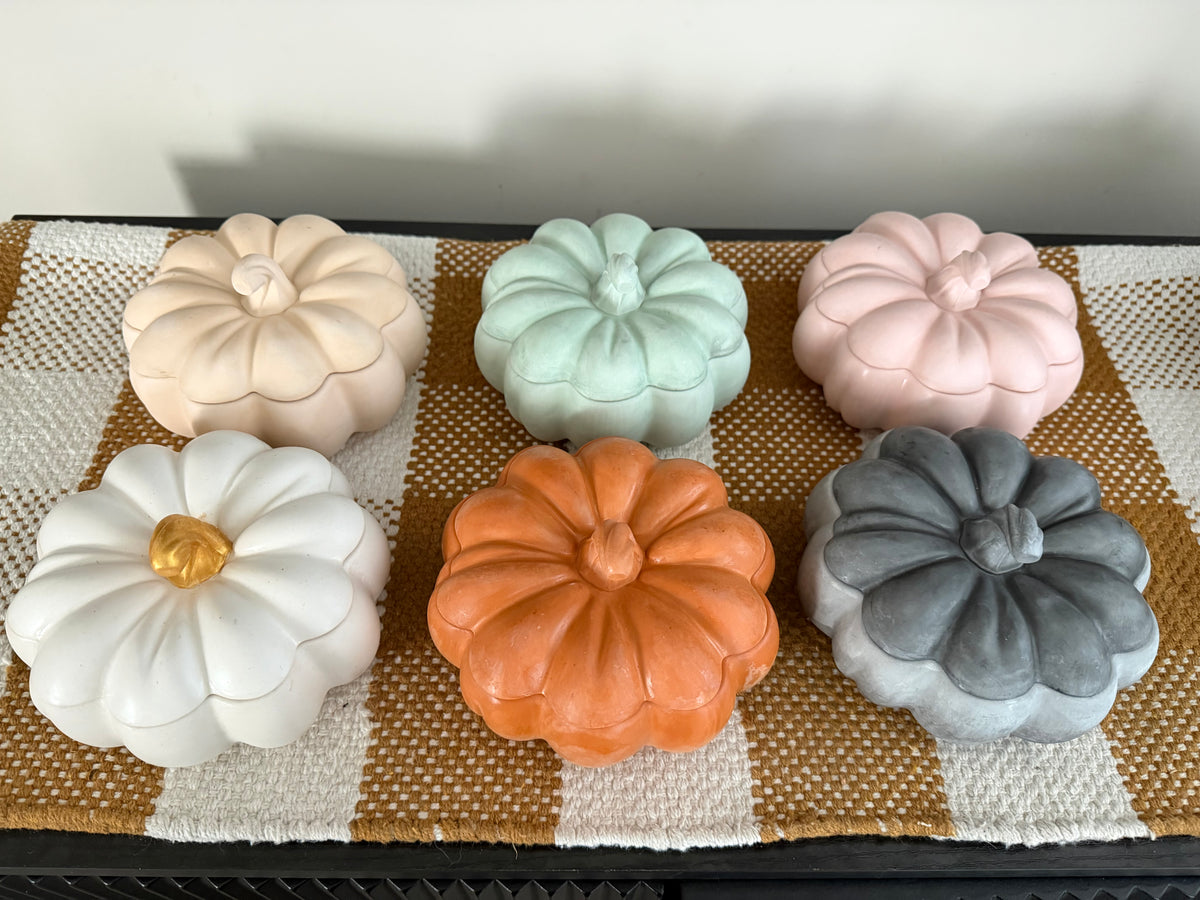Handmade concrete pumpkin candles styled for fall by Aura Aligned Creations